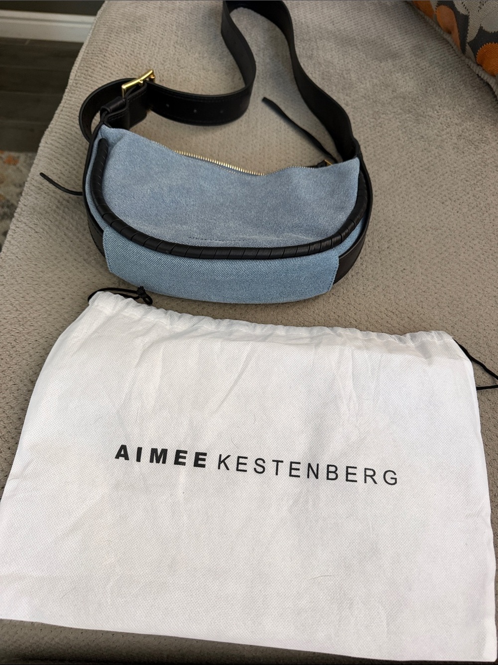 Aimee Kestenberg Sky Blue Suede Crescent Crossbody with Black Trim